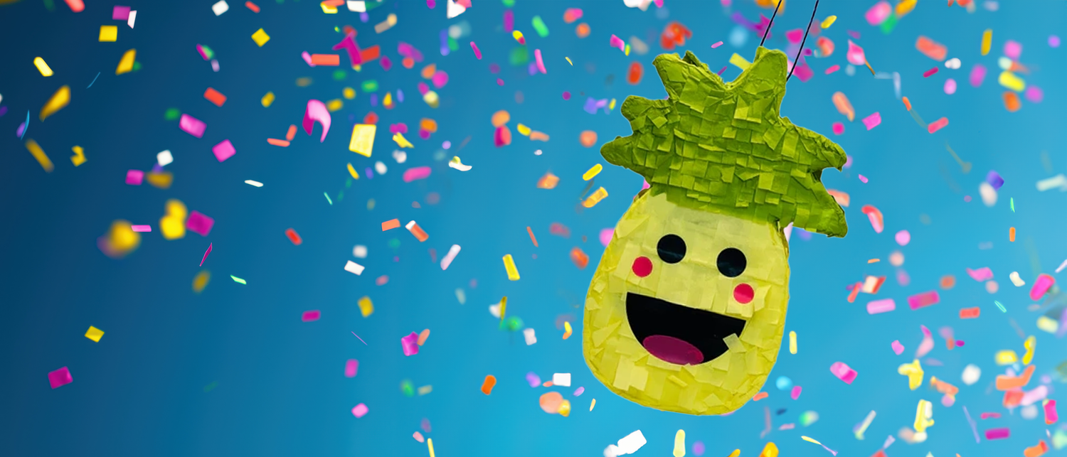 Smiling Pineapple Piñata with colorful confetti background